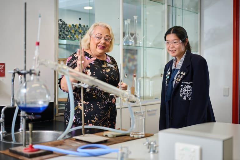 Teacher and student in a science lab.